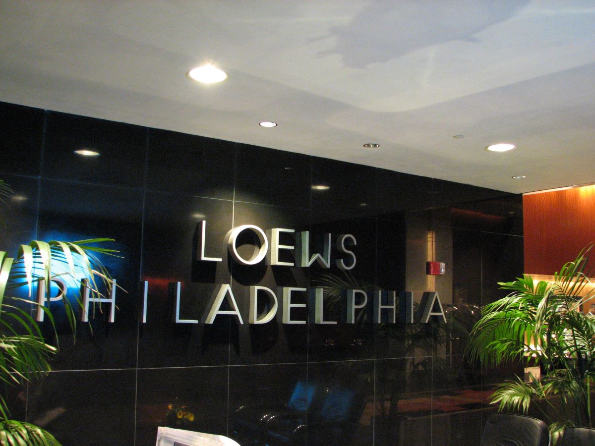 The words "loews Philadelphia" on a wall inside the hotel.